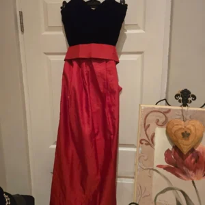 evening dress size 8 velvet and satin with a big red bow at the back.